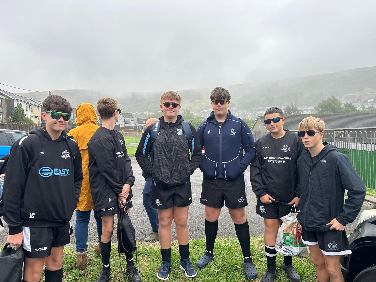 Whitchurch U15s squad at Gilfach Goch on a grey morning, hillside behind